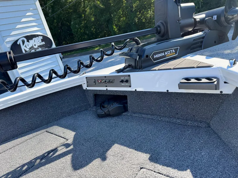 Slide: The Image of 2025 Vexus ADX180LS boat with Minn Kota trolling motor, gray interior. - 6