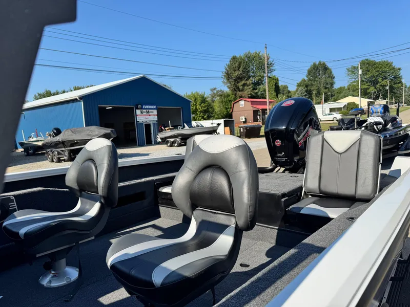 Slide: The Image of 2025 Vexus ADX180LS boat interior with sleek seating and powerful engine. - 8