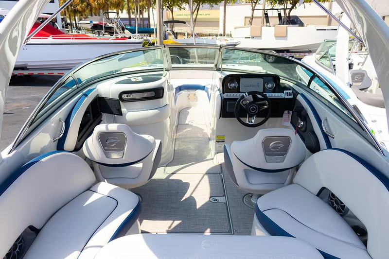 Slide: The Image of Interior of 2022 Crownline E 255 XS boat, featuring modern seating and dashboard. - 20