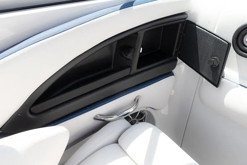 Slide: The Image of 2022 Crownline E 255 XS boat interior storage compartment and seating detail. - 16