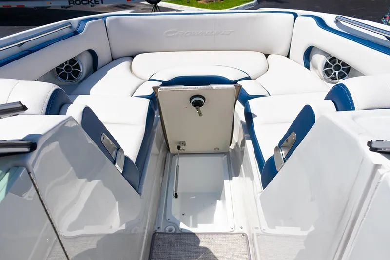 Slide: The Image of 2022 Crownline E 255 XS boat interior with white and blue seating. - 6