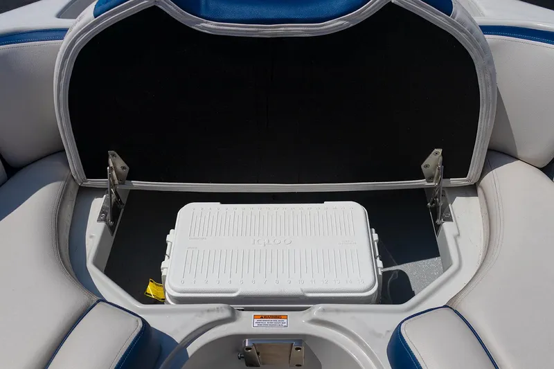 Slide: The Image of 2022 Crownline E 255 XS boat storage compartment with cooler. - 7