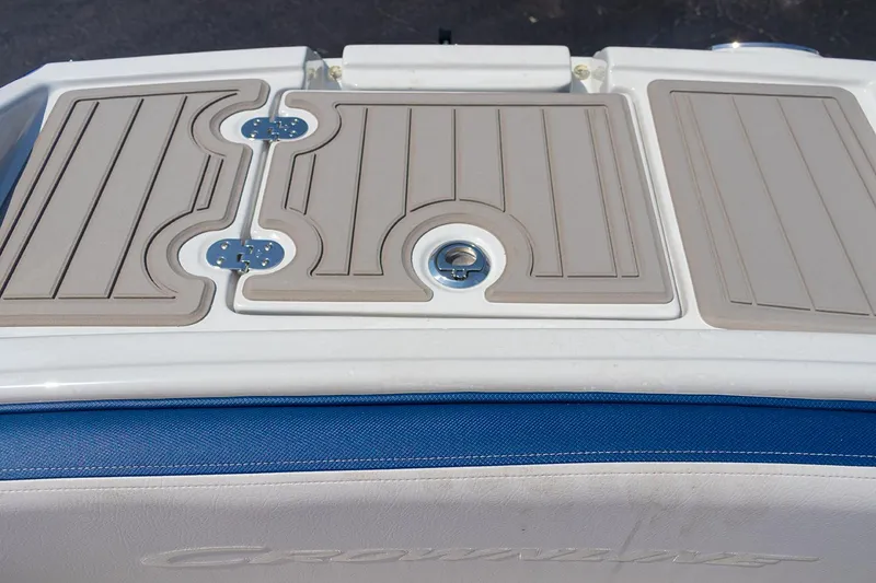 Slide: The Image of 2022 Crownline E 255 XS boat deck with beige non-slip surface. - 8