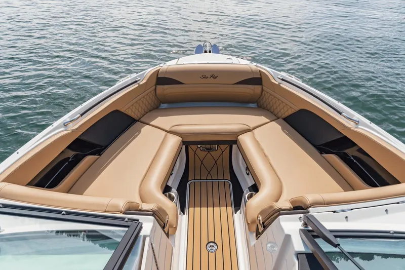 Slide: The Image of 2024 Sea Ray SLX 280 Outboard boat with luxurious tan seating on the water. - 38