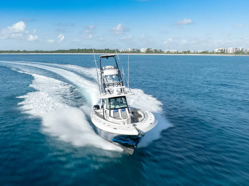 Slide: The Image of 2014 Hydra-Sports 42 Custom Siesta boat cruising on open blue water. - 10