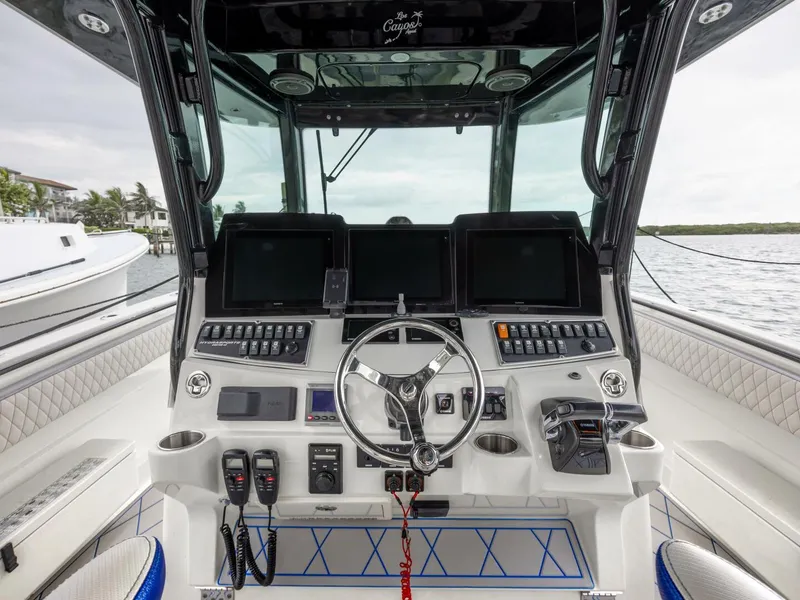 Slide: The Image of 2014 Hydra-Sports 42 Custom Siesta boat cockpit with advanced navigation controls. - 17