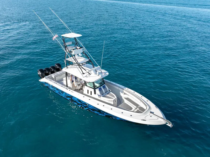 Slide: The Image of 2014 Hydra-Sports 42 Custom Siesta boat on clear blue water. - 4