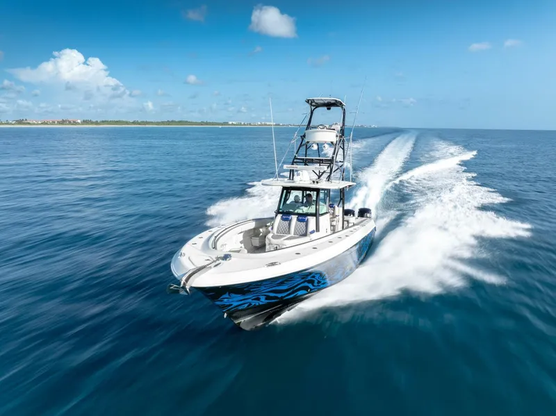 Slide: The Image of 2014 Hydra-Sports 42 Custom Siesta cruising on open blue water. - 9