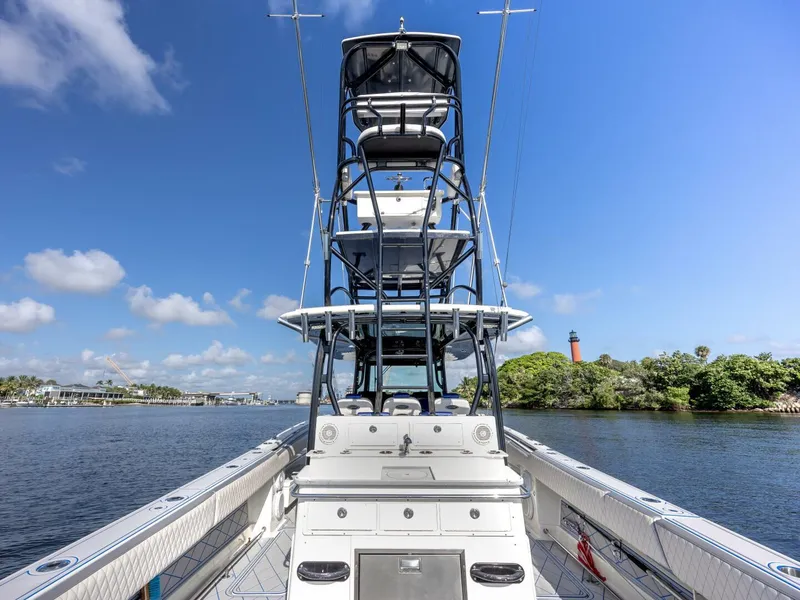 Slide: The Image of 2014 Hydra-Sports 42 Custom Siesta boat on calm water, clear sky background. - 12