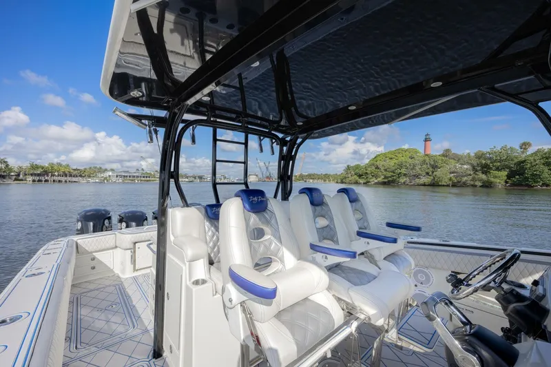 Slide: The Image of 2014 Hydra-Sports 42 Custom Siesta boat interior with white seating and scenic water view. - 16
