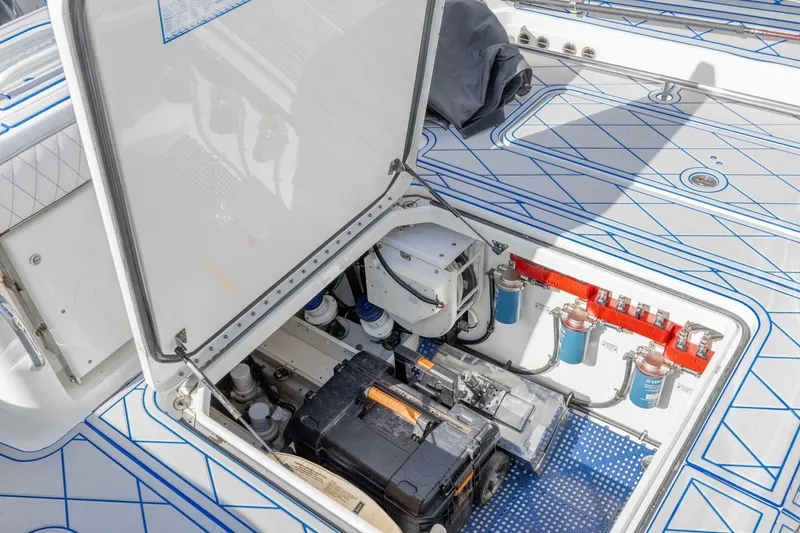 Slide: The Image of 2014 Hydra-Sports 42 Custom Siesta engine compartment with open hatch, showcasing internal components. - 24