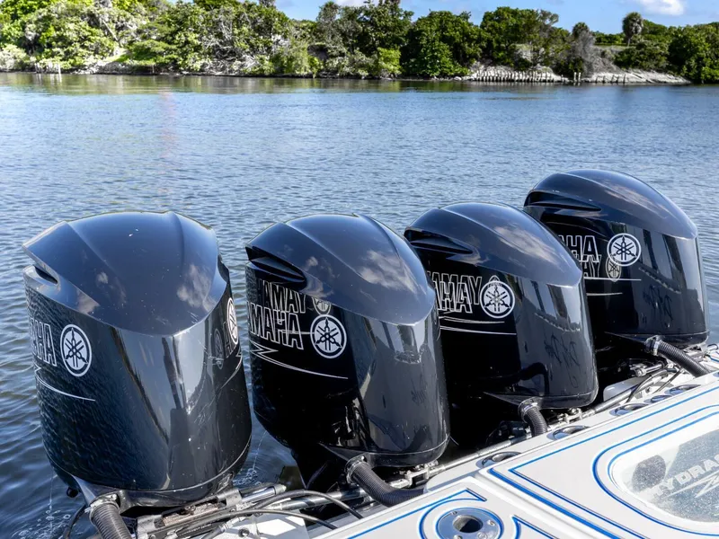 Slide: The Image of Four Yamaha outboard motors on a 2014 Hydra-Sports 42 Custom Siesta boat. - 27