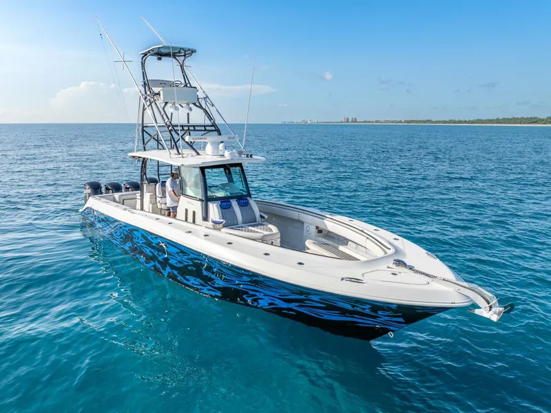 Slide: The Image of 2014 Hydra-Sports 42 Custom Siesta boat on clear blue ocean water. - 5