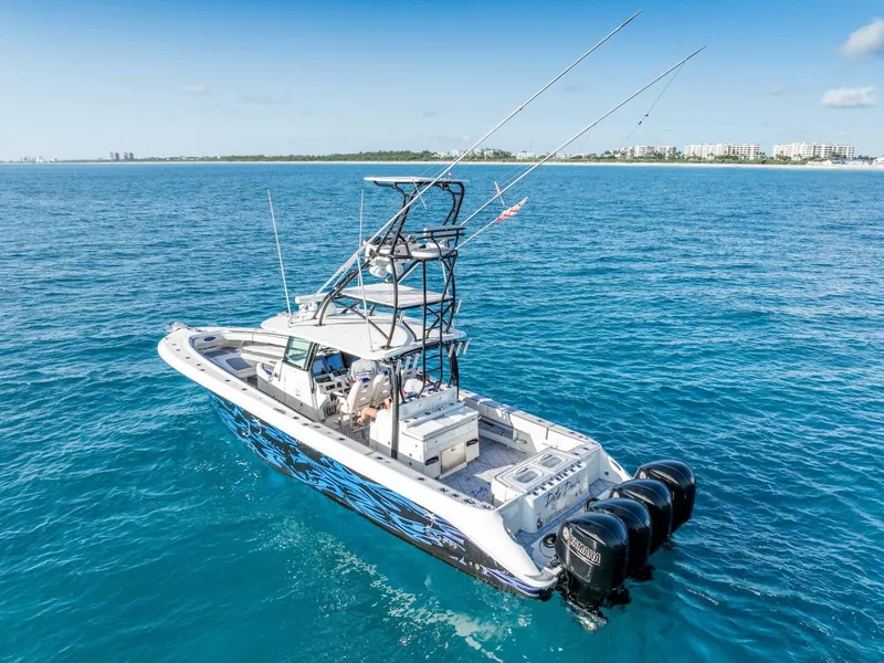 Slide: The Image of 2014 Hydra-Sports 42 Custom Siesta boat on open water, featuring multiple outboard engines. - 6