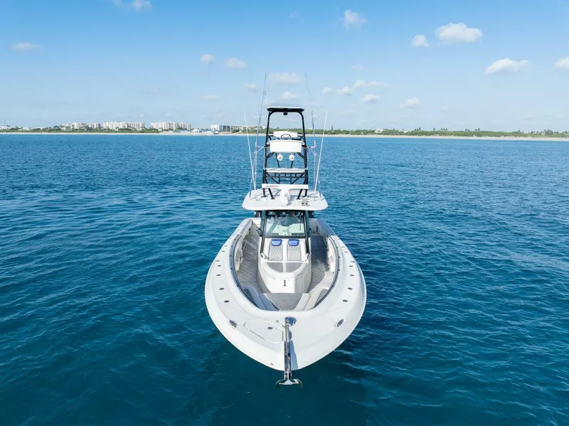 Slide: The Image of 2014 Hydra-Sports 42 Custom Siesta boat on calm blue water. - 7