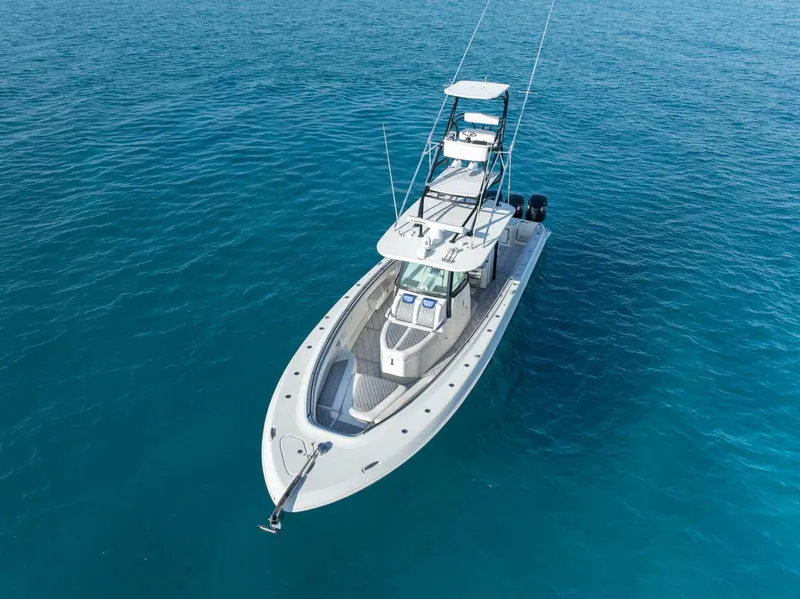 Slide: The Image of 2014 Hydra-Sports 42 Custom Siesta boat on clear blue water. - 8