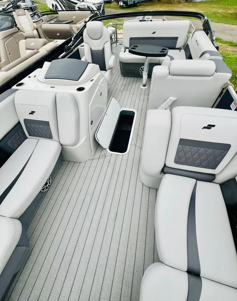 Slide: The Image of 2025 Starcraft CX 23 DL BAR pontoon boat interior with luxurious seating and modern design. - 5