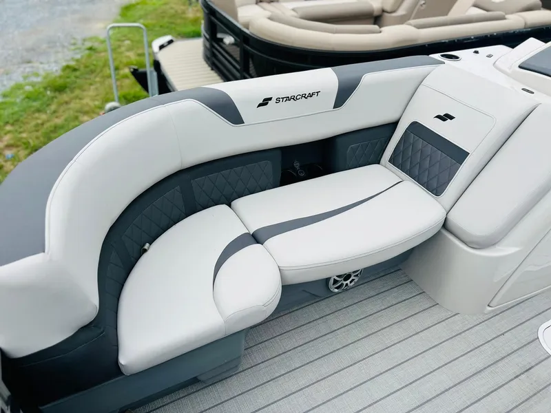Slide: The Image of 2025 Starcraft CX 23 DL BAR boat interior with sleek, modern seating design. - 7