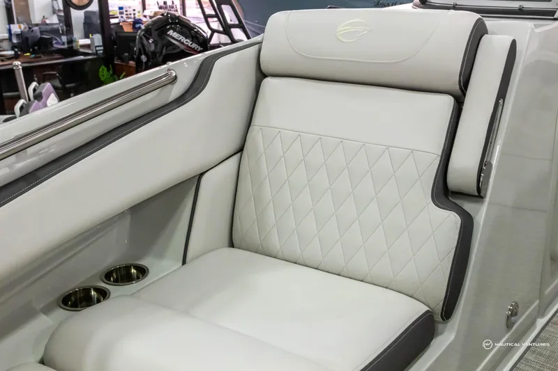 Slide: The Image of 2023 Crownline 260 XSS boat interior with luxurious seating and cup holders. - 15