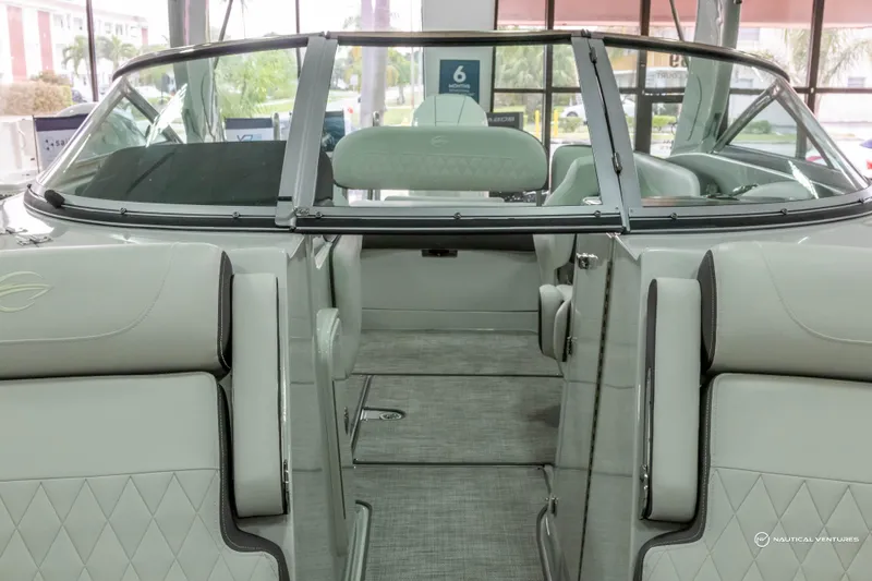 Slide: The Image of 2023 Crownline 260 XSS boat interior with elegant seating and modern design. - 16