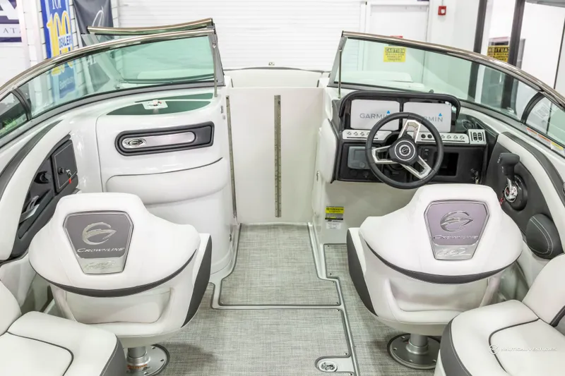 Slide: The Image of 2023 Crownline 260 XSS boat interior with modern dashboard and seating. - 17