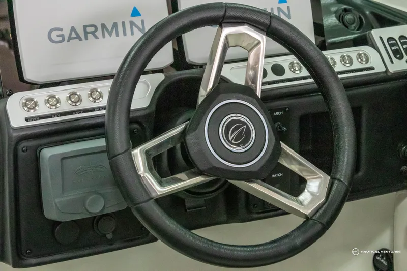 Slide: The Image of Steering wheel of 2023 Crownline 260 XSS boat with Garmin navigation system. - 20