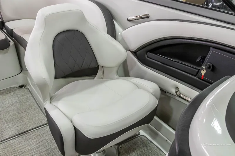 Slide: The Image of 2023 Crownline 260 XSS boat interior with plush seating and modern design. - 23
