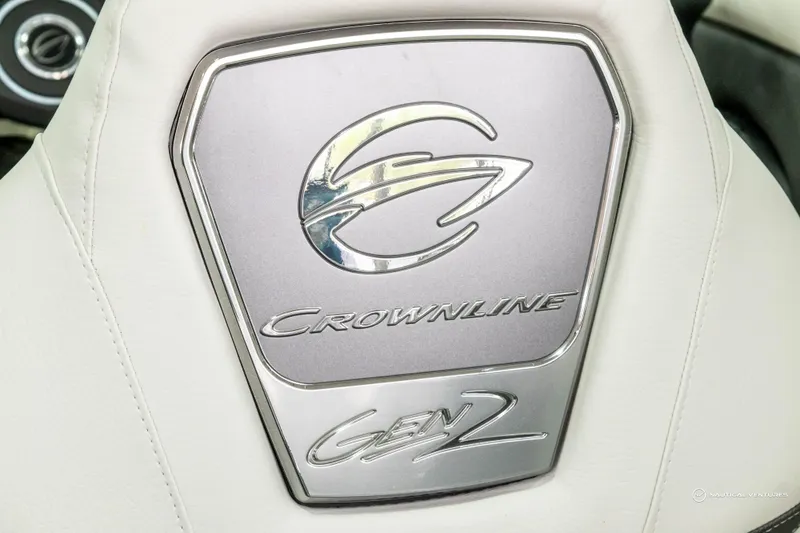 Slide: The Image of Crownline 260 XSS 2023 logo on white leather seat, featuring Gen 2 emblem. - 24