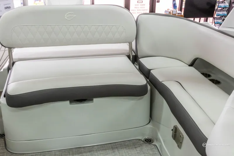 Slide: The Image of 2023 Crownline 260 XSS boat interior seating with white and gray upholstery. - 30