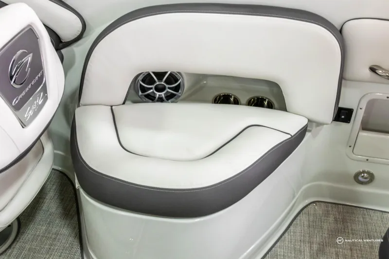 Slide: The Image of 2023 Crownline 260 XSS boat interior with cushioned seating and speaker. - 31