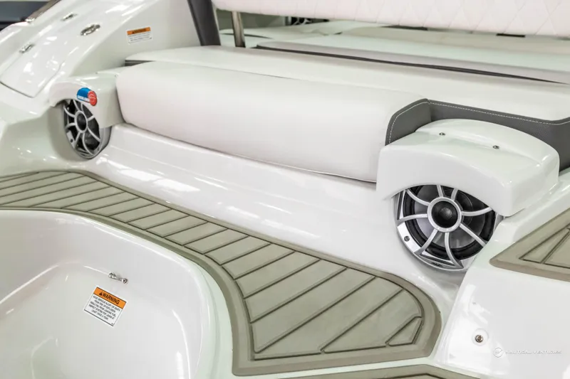 Slide: The Image of 2023 Crownline 260 XSS boat interior with speakers and cushioned seating. - 40