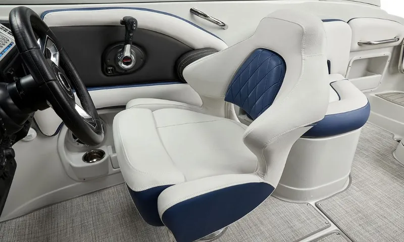 Slide: The Image of 2023 Crownline 260 XSS boat interior with stylish white and blue seating. - 47