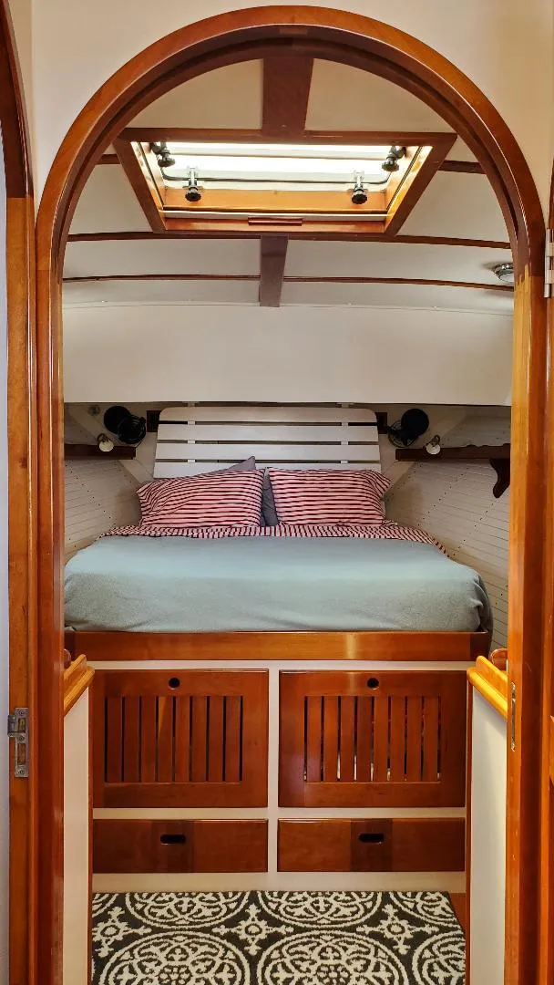 Slide: The Image of Cozy cabin interior of 1997 Lyman-Morse Custom Flybridge with wood accents and skylight. - 21