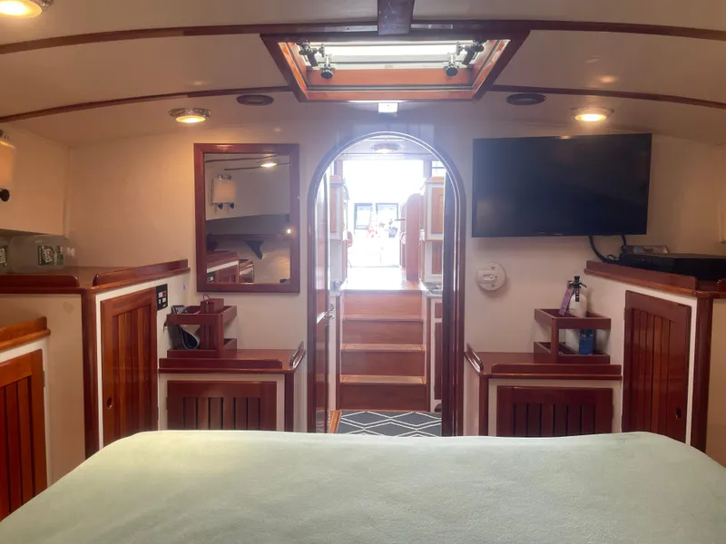 Slide: The Image of Luxurious interior of 1997 Lyman-Morse Custom Flybridge yacht with wood accents and modern amenities. - 22