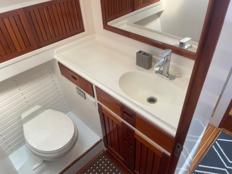 Slide: The Image of Bathroom interior of 1997 Lyman-Morse Custom Flybridge yacht with sink and toilet. - 26