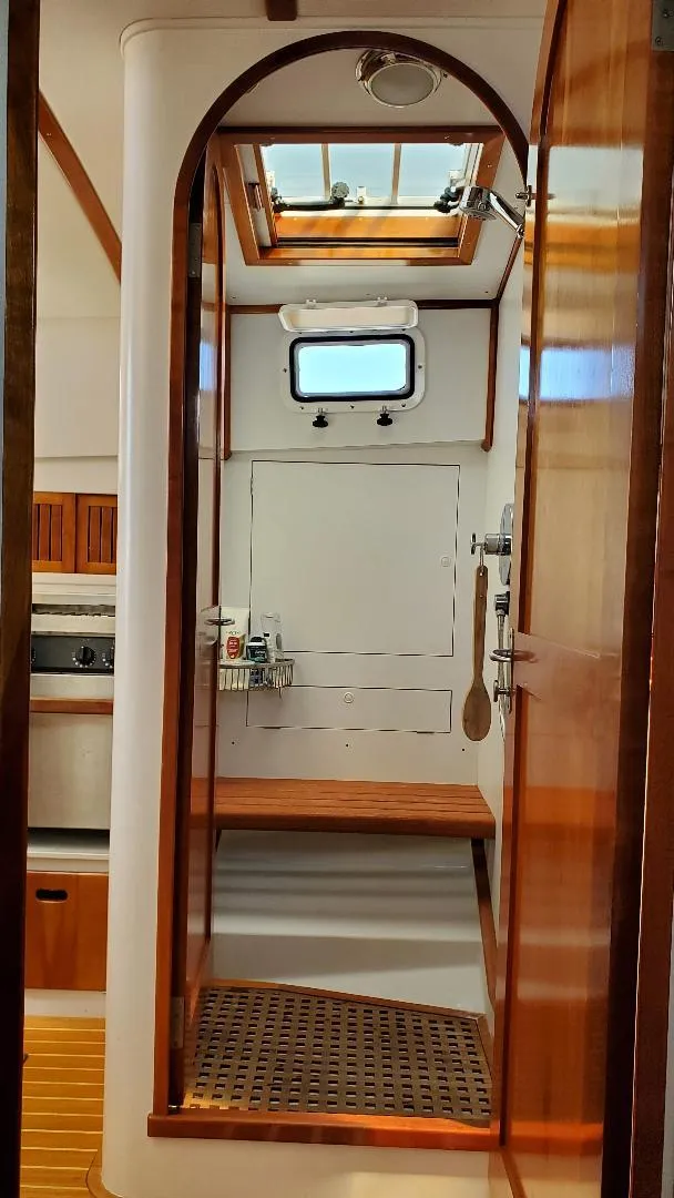 Slide: The Image of Interior of 1997 Lyman-Morse Custom Flybridge yacht with wooden accents and skylight. - 32