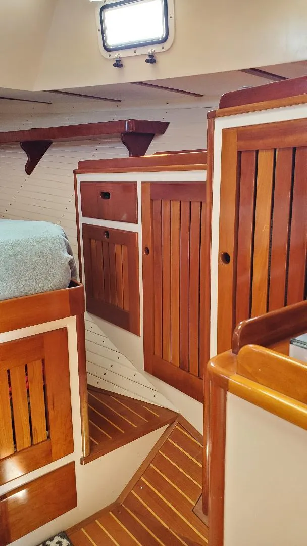 Slide: The Image of Interior of 1997 Lyman-Morse Custom Flybridge with wooden cabinetry and flooring. - 33