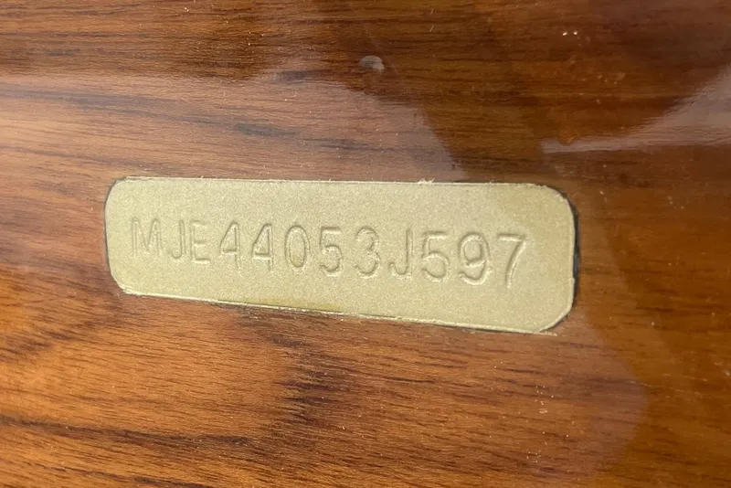 Slide: The Image of VIN plate on 1997 Lyman-Morse Custom Flybridge boat, displaying serial number MJE44053J597. - 36