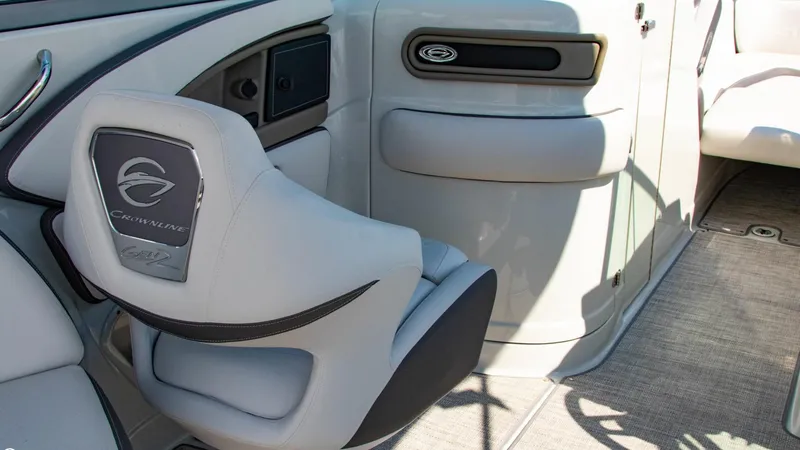 Slide: The Image of Interior of 2023 Crownline 290 XSS boat with sleek seating and modern design. - 13