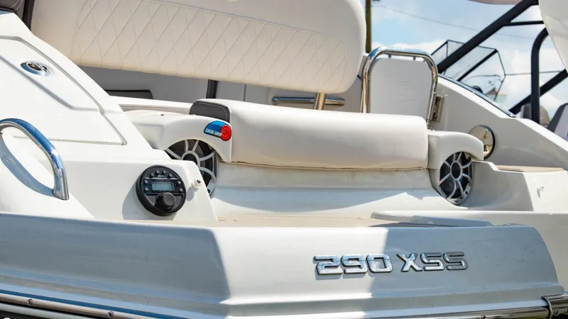 Slide: The Image of 2023 Crownline 290 XSS boat interior with seating and audio system. - 8
