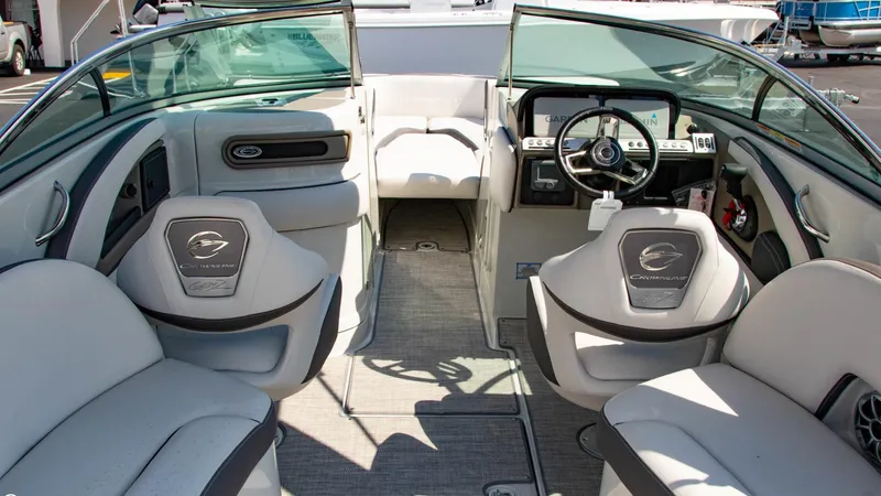Slide: The Image of Interior of 2023 Crownline 290 XSS boat with modern seating and steering wheel. - 9