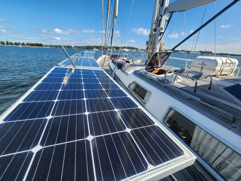 Slide: The Image of Sailboat with solar panels on deck, Hallberg-Rassy 62, 2008 model, on calm water. - 11