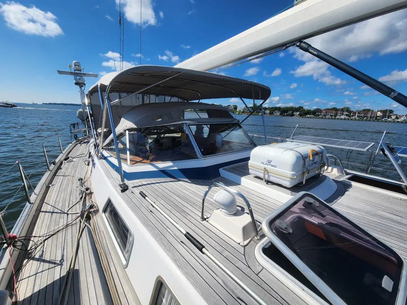 Slide: The Image of 2008 Hallberg-Rassy 62 yacht on water, sunny day, clear sky, spacious deck. - 13