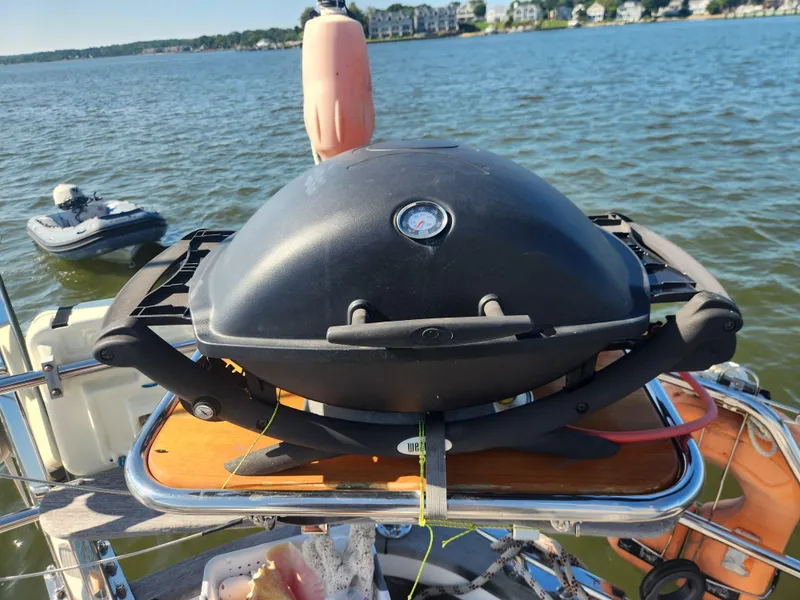 Slide: The Image of Barbecue grill on a 2008 Hallberg-Rassy 62 yacht, with scenic waterfront view. - 20