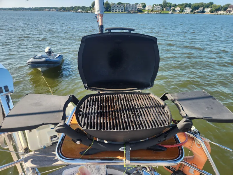 Slide: The Image of Grill on a 2008 Hallberg-Rassy 62 yacht with scenic lake view. - 21