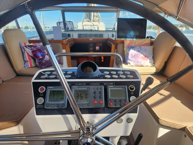 Slide: The Image of Cockpit view of 2008 Hallberg-Rassy 62 yacht with navigation instruments and comfortable seating. - 23