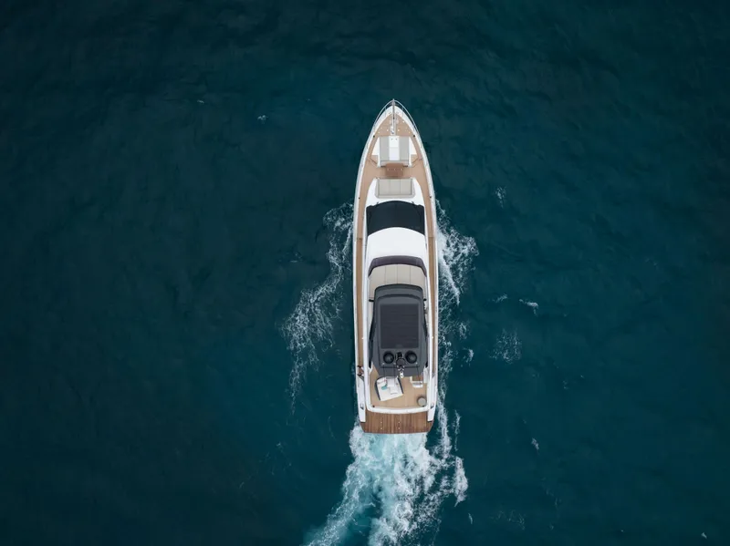 Slide: The Image of Aerial view of 2023 Ferretti Yachts 720 cruising on open water. - 11
