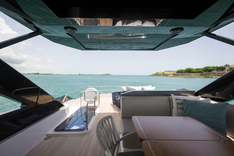 Slide: The Image of Luxurious 2023 Ferretti Yachts 720 interior with ocean view and elegant seating area. - 12