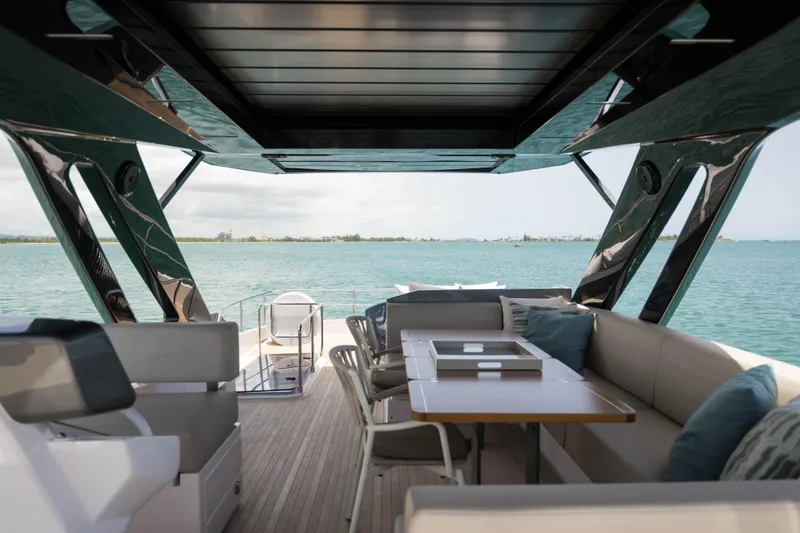 Slide: The Image of Luxurious 2023 Ferretti Yachts 720 interior with ocean view and elegant seating area. - 18