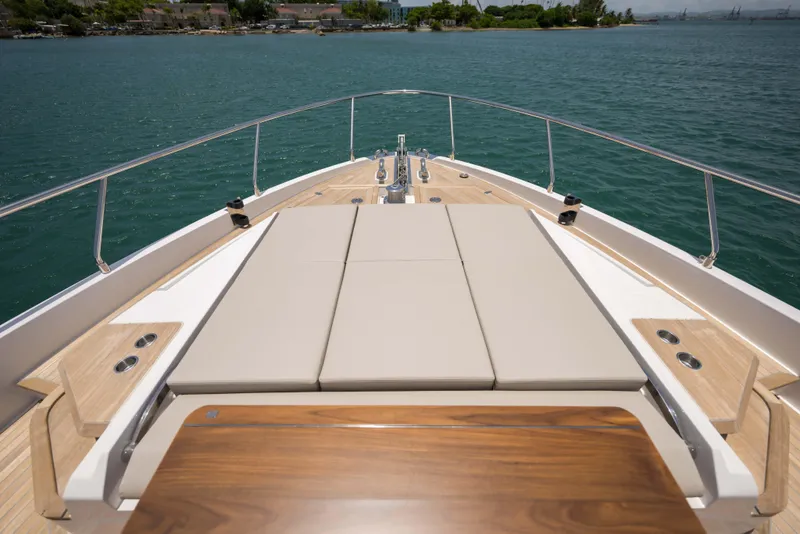 Slide: The Image of Luxurious 2023 Ferretti Yachts 720 deck with sunbathing area and ocean view. - 20